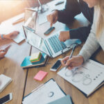 Meeting room situation. General business discussion in cozy open space office. Four people