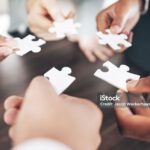 Business people, hands or puzzle for solution or problem solving with planning, teamwork or collaboration. Jigsaw, zoom or partnership support, project development ideas or community group mission